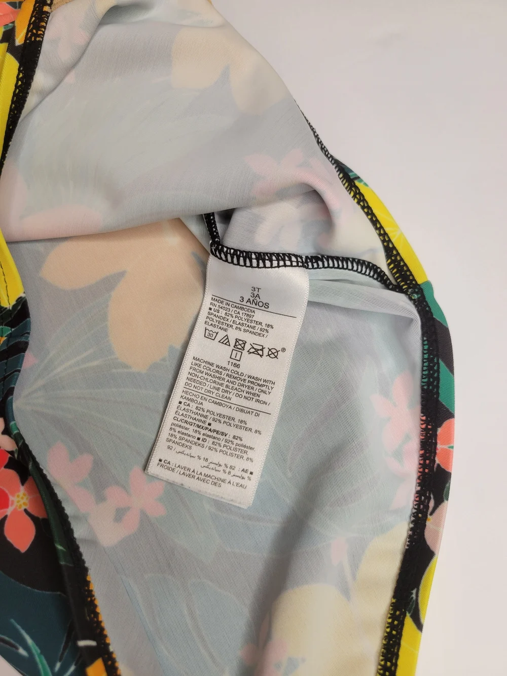 Old Navy toddler girl's long-sleeve, one-piece swimsuit featuring a black floral - Picture 3 of 6